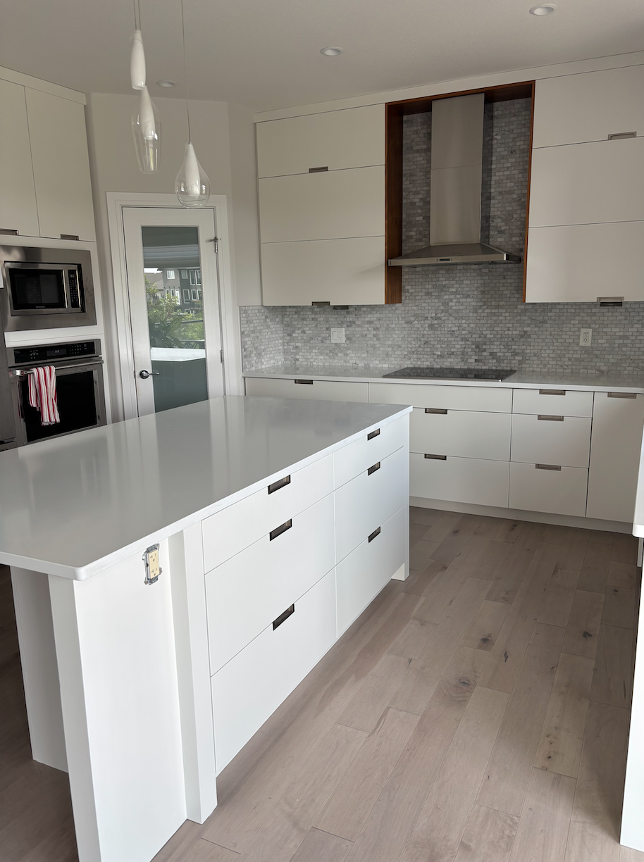 🌳 Less Grain, More Calm<br />
Another priority for this project was reducing the visual “noise” in the space.</p>
<p>The original kitchen had a lot of visible wood grain—especially in the lower cabinets—which made the room feel busier and more rustic than the homeowners wanted. After the water damage, they saw an opportunity to shift to something cleaner, more contemporary, and easier on the eyes.</p>
<p>We helped them tone down the wood grain by refinishing the damaged cabinetry in a soft, grain-minimizing colour that still offered warmth but without the bold patterns of natural wood. The end result brought a calm, modern energy to the kitchen—while still keeping that welcoming, family-home feel that Willowgrove homes are known for.</p>
<p>🔧 From Problem to Possibility<br />
What started as a repair project quickly became something more: a fresh start. These Willowgrove homeowners didn’t just restore what was lost—they used the moment to improve, update, and upgrade.</p>
<p>Whether it’s water damage, wear and tear, or just time for a change, we love helping Saskatoon homeowners reimagine their kitchens in ways that fit their lifestyle and taste—without the cost or chaos of a full renovation.</p>
<p>Thinking of a Change?<br />
If your kitchen needs repairs, or you’re simply tired of the look, you don’t have to start from zero. With expert colour matching, custom cabinet refinishing, and smart design upgrades, Trifecta Kitchen Solutions can help you refresh your space beautifully—and cost-effectively.
